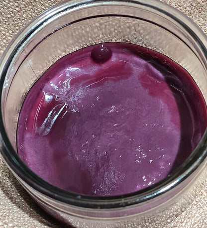 Probiotic red wine vinegar mother SCOBY fermenting in a glass jar.