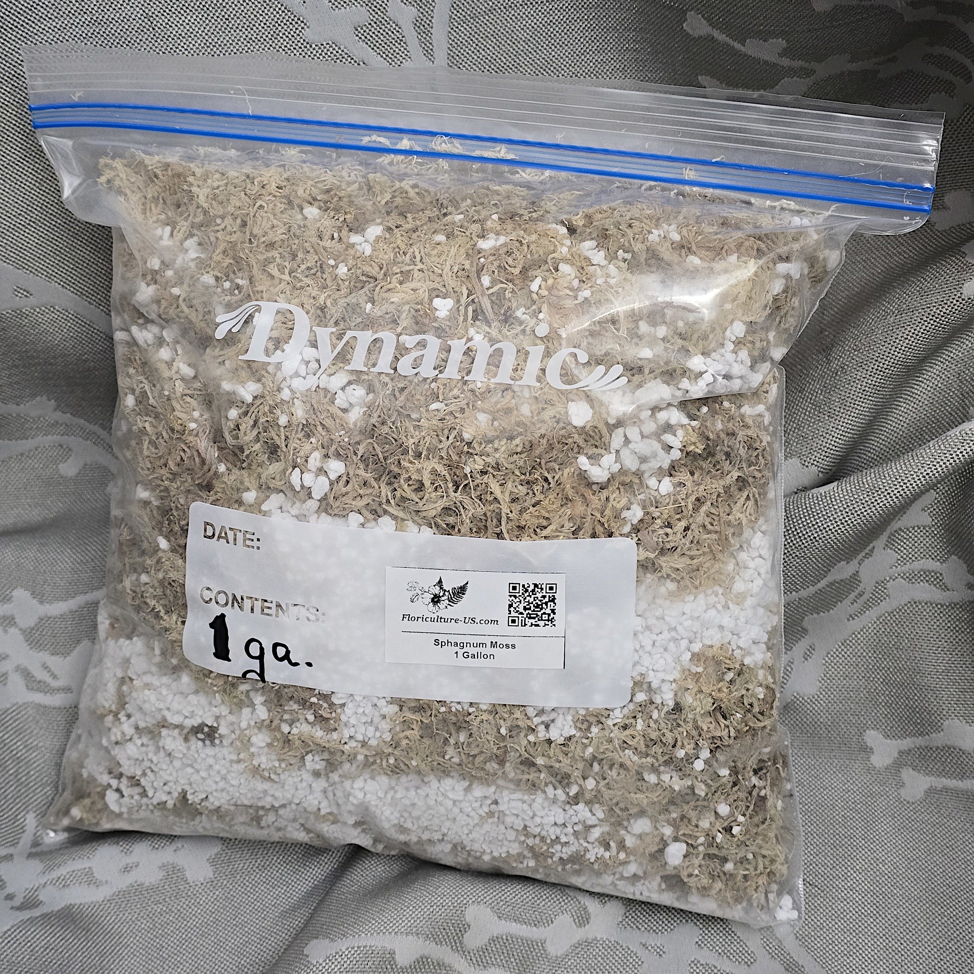 One gallon clear plastic bag filled with loose dry sphagnum moss and perlite soil blend. Bulk substrate for indoor plants.